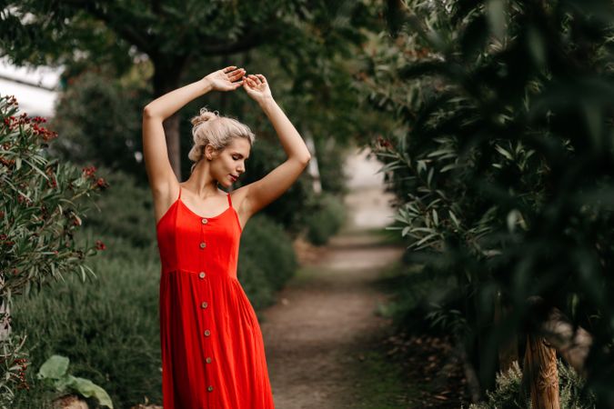 Dreamy young woman in summer garden