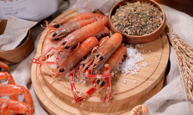 Fresh shrimp. Seafood on a plate. Prawns with salt.