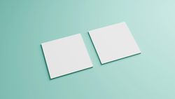 Square paper cards on mint green background, copy space