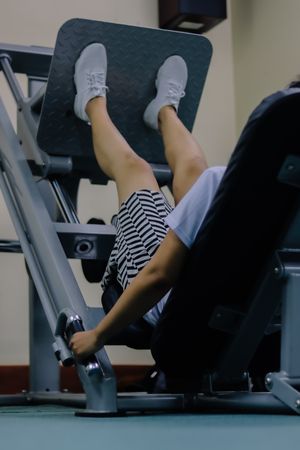 woman gripping the handles of the machine
