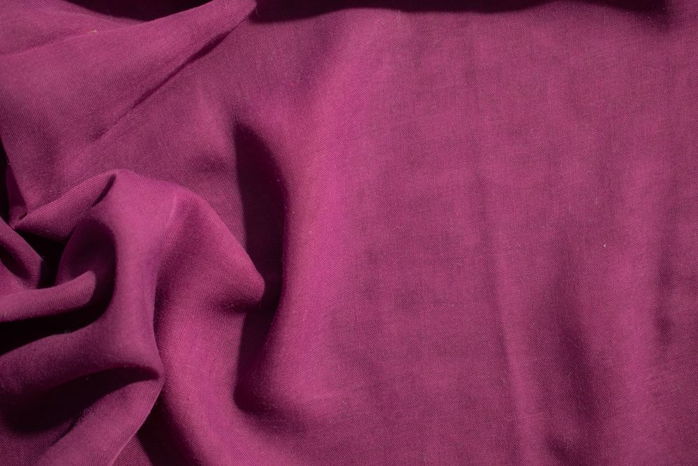 Soft purple fabric wavy crumpled background abstract with copy space