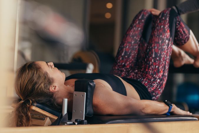 Pilates woman at a gym doing exercises