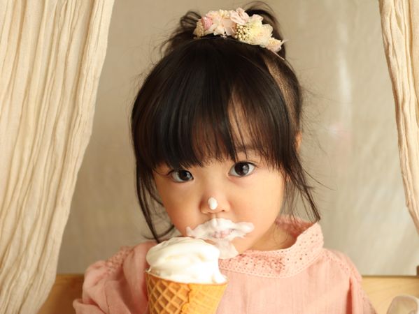 Young girl eating ice cream