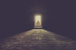 Man sitting on basement stairs