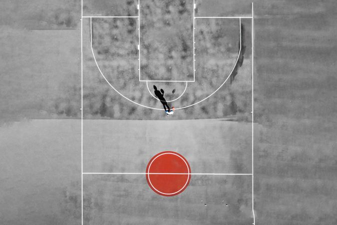 Basketball in greyscale seen from the above with Japanese flag used as an inspiration