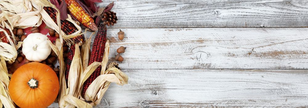 Autumn Holiday Decor on light rustic wood with copy space