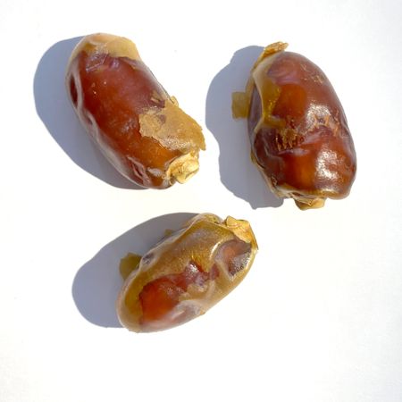 dried date fruit isolated on plain background