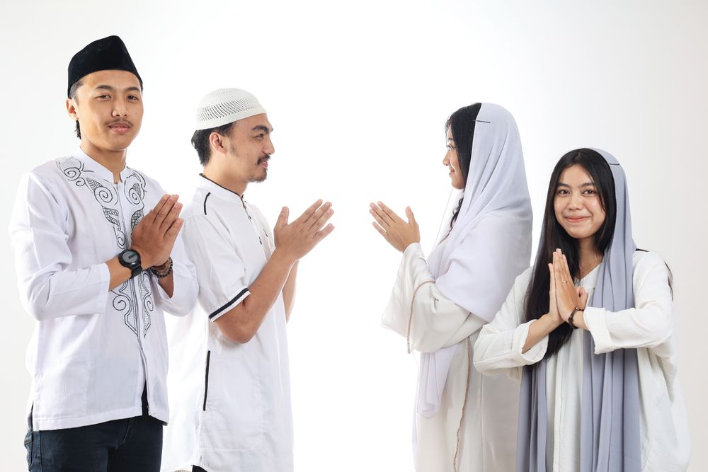 Asian People Friends Forgiving Each Other during Eid Mubarak Celebration