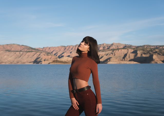 Sensual female standing near water