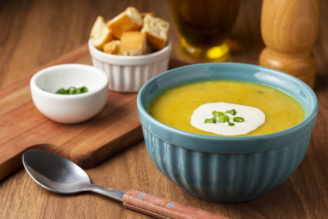Bowl with pumpkin soup on the table.
