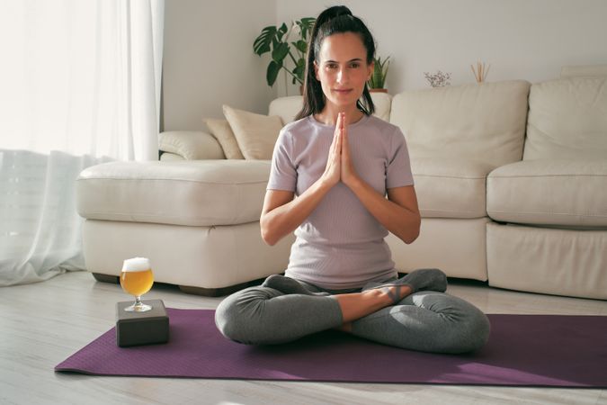 Woman meditating with beer