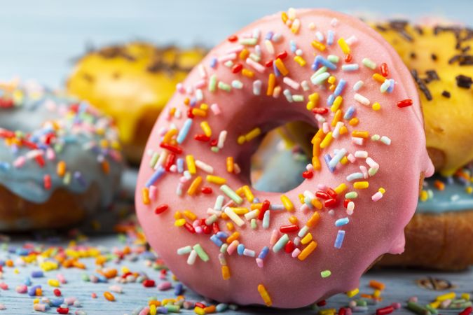 Delicious assorted colorful donuts on the table.