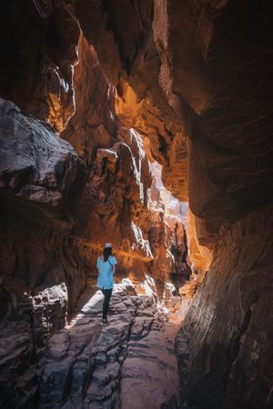 Anonymous traveler in rocky ravine