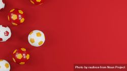 Spanish football tribute: Red and yellow soccer balls on red background with copy spacae 4MXPy5