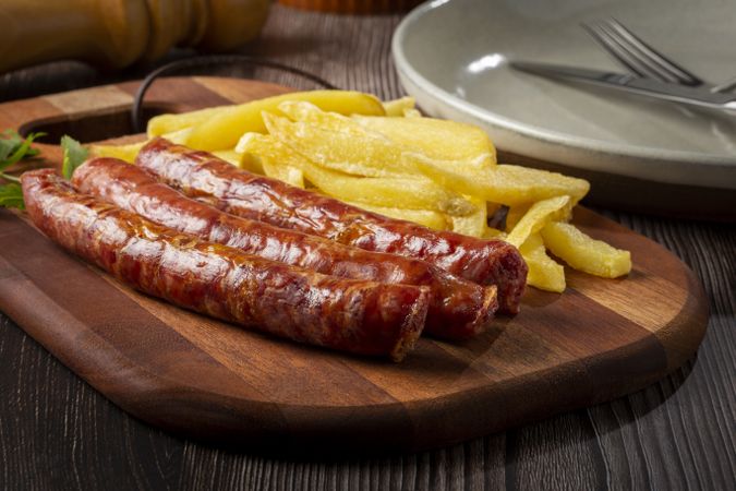 Grilled German sausage with french fries.