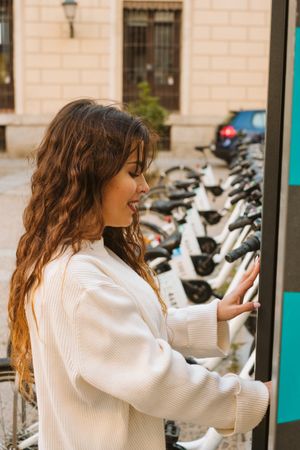 Smiling woman on rental bike