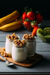 Glass bottles with milk and walnuts