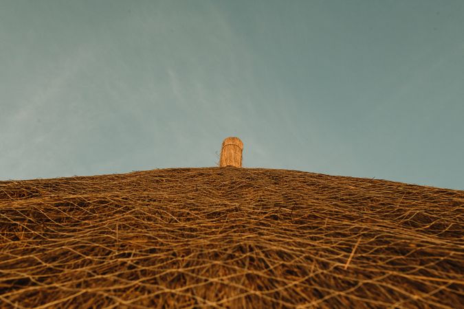 Thatched roof against blue sky