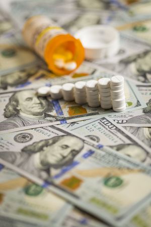 Medicine Pills Stacked on Newly Designed One Hundred Dollar Bills
