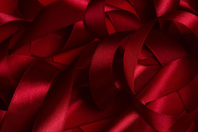 Close up of curled red satin ribbons