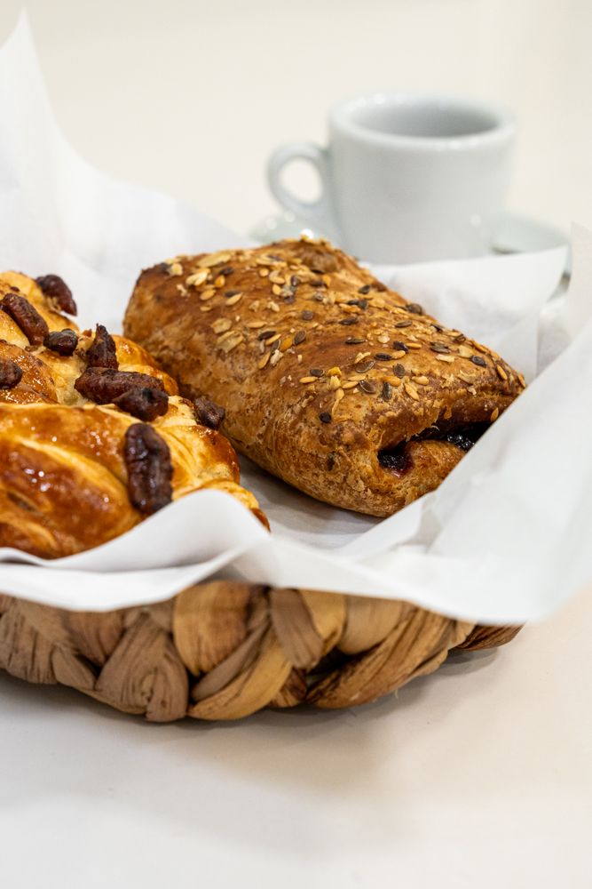 Fresh baked pastries breakfast assortment whole grain bread croissant coffee morning artisan bakery organic seeds healthy food