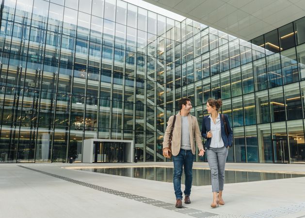 Positive businesspeople walking from work together