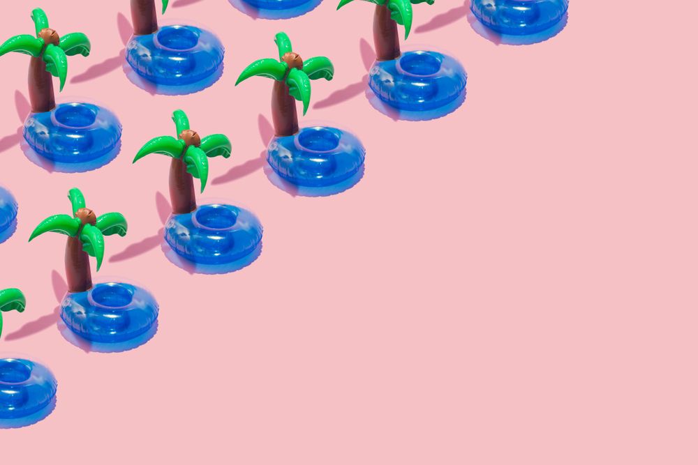 Tropical palm inflatable toy pattern on pink background