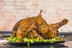 Baked chicken with lettuce on pan