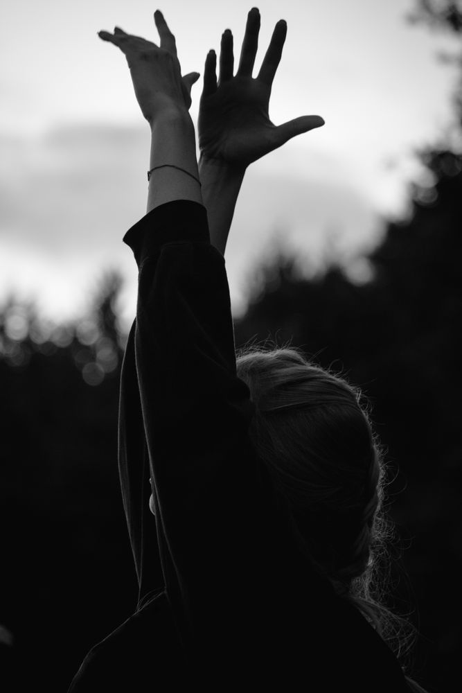 Woman meditating during sunset in nature