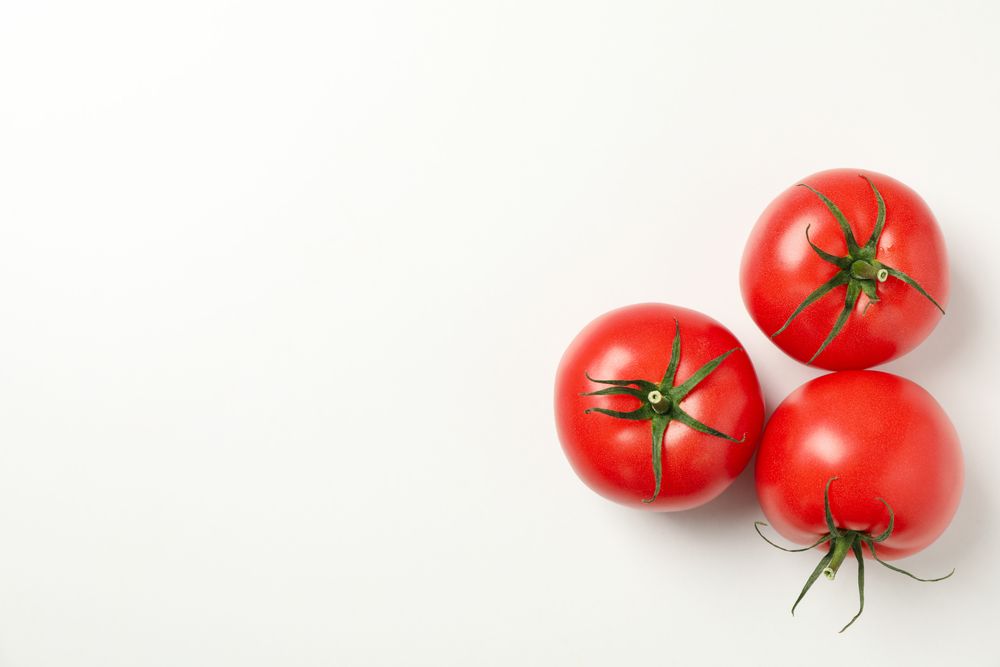 Fresh ripe tomatoes on neutral background, top view