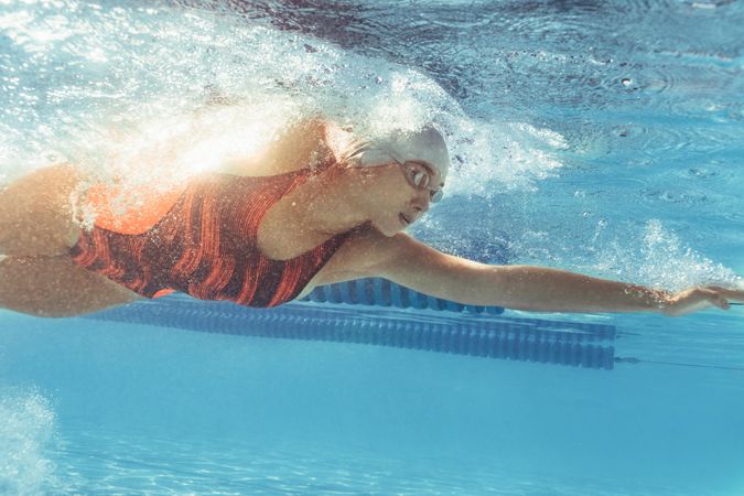 Female swimmer inside swimming pool