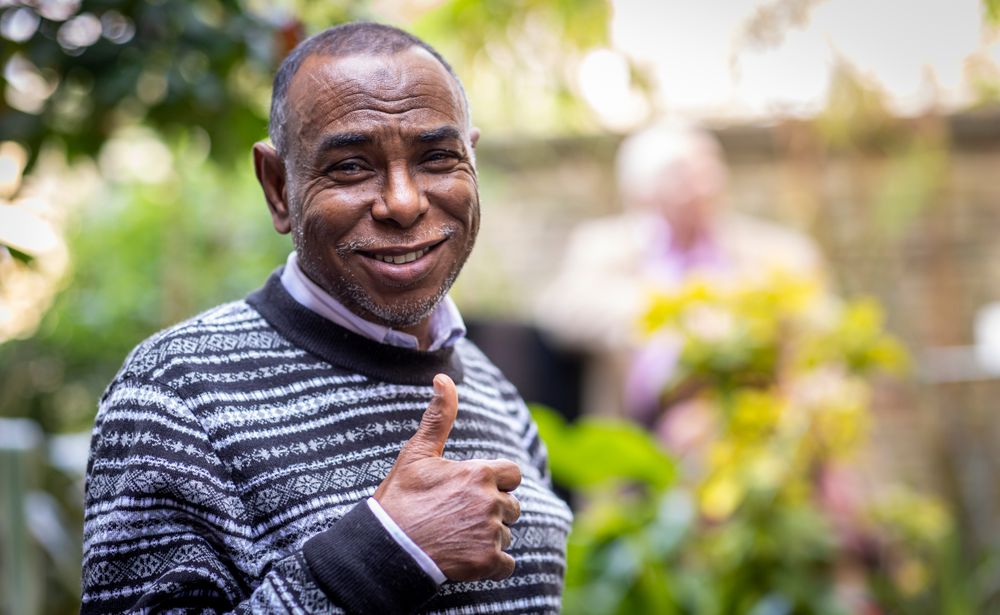 Portrait of older Black male outside