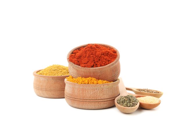 Colorful spices in wooden bowls