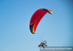 Two people parachuting under blue sky 42Epm5