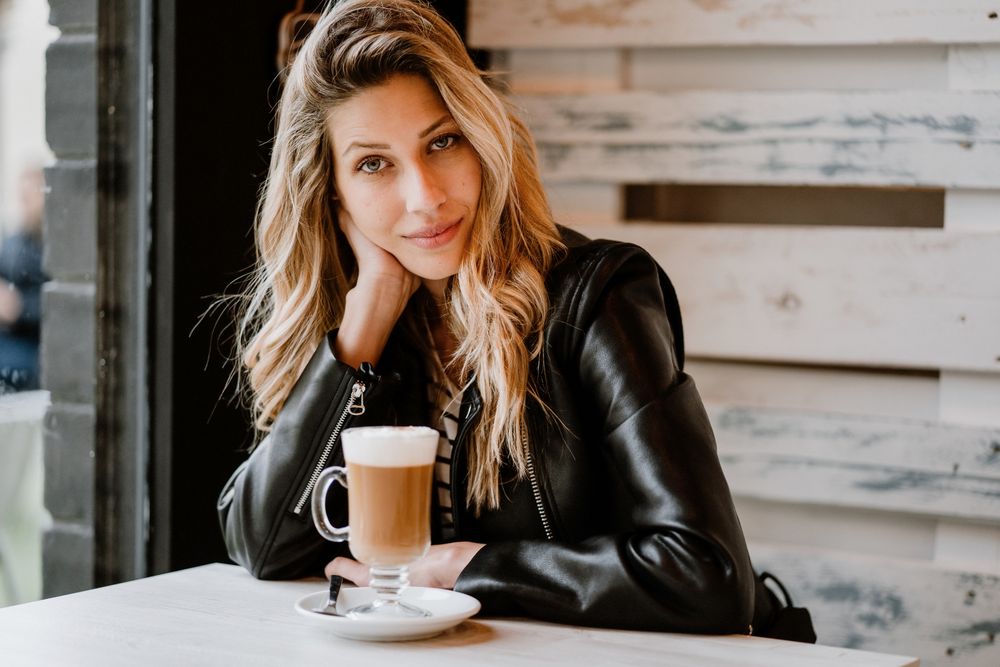 Woman drinking coffee from a glass