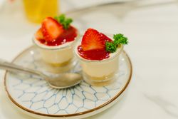 Delicious Italian dessert Panna Cotta with fresh summer strawberries