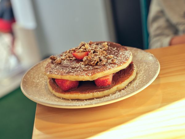 Delicious pancakes with fresh strawberries