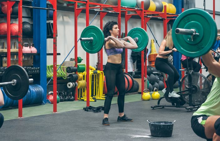 Woman practicing weightlifting in the gym