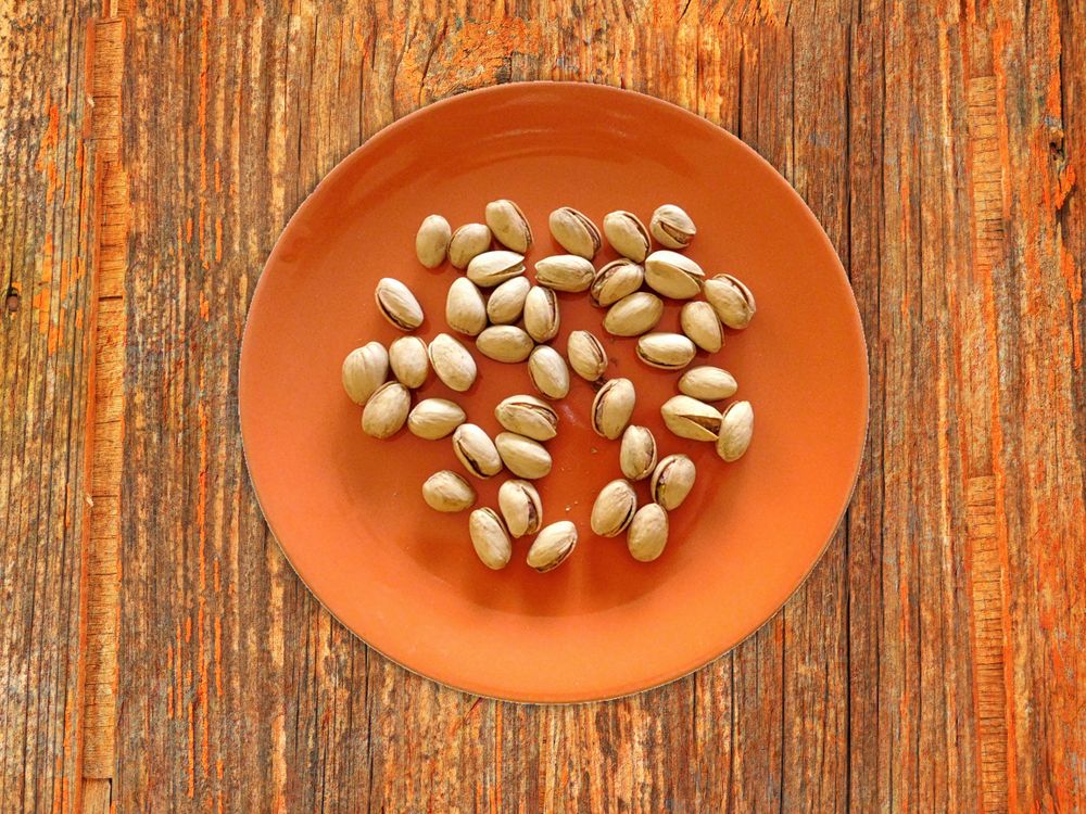 Pistachios On The Wooden Background