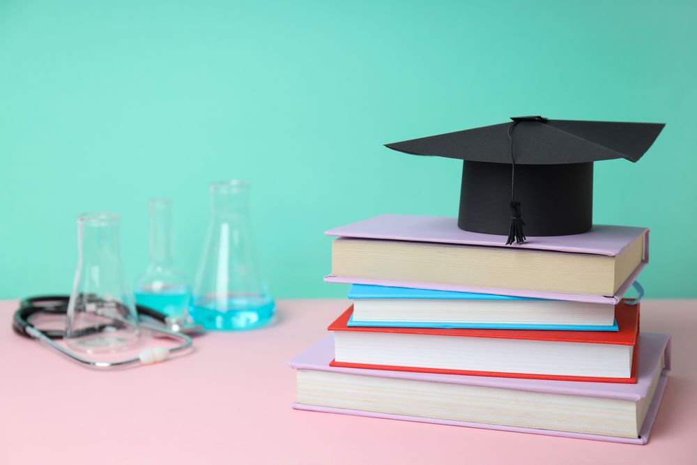 Concept of medical education and books, space for text