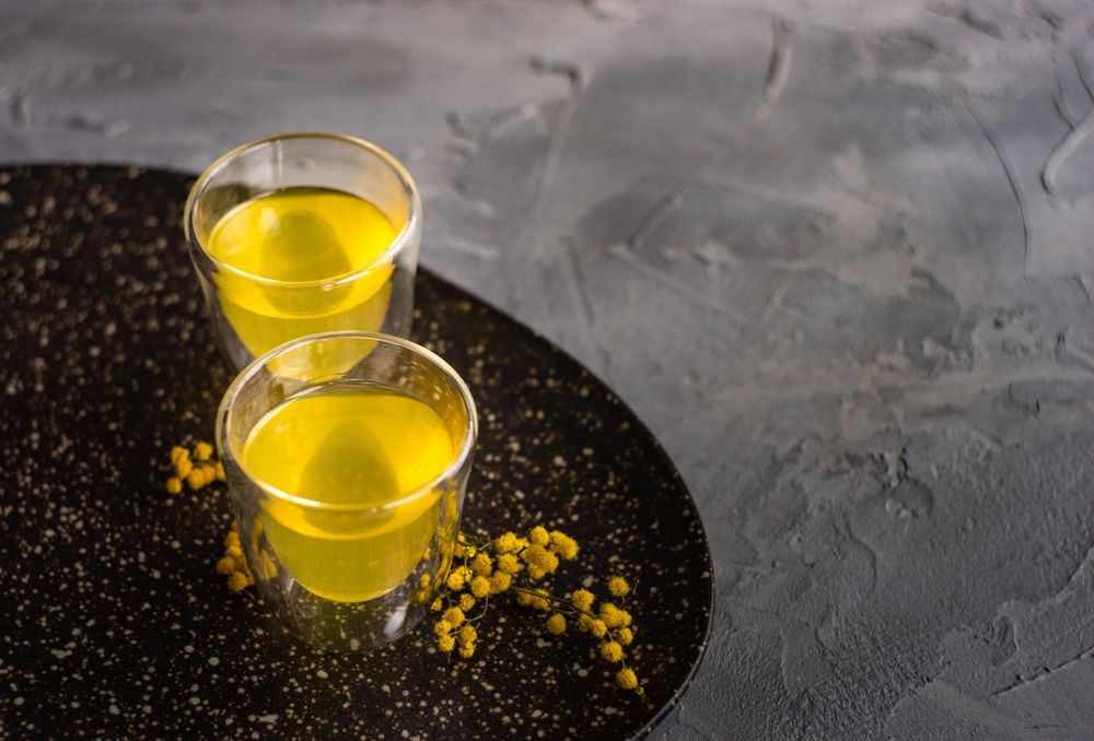 Two glasses of Italian digestif limoncello with garnish