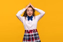 Girl holding head with both hands