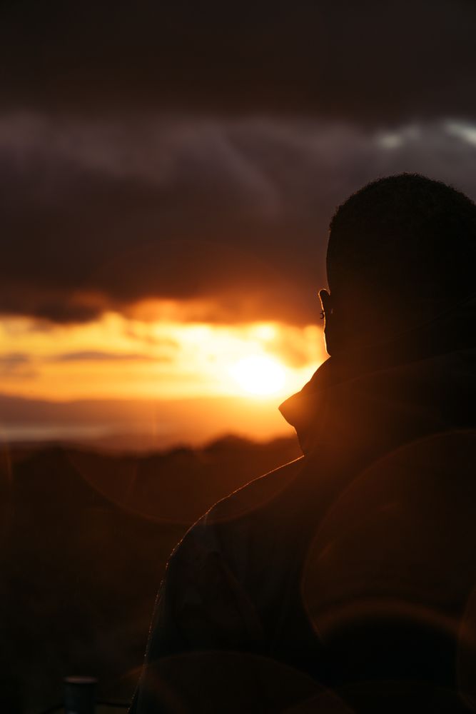 Man watching the sunset in the countryside in Costa Rica