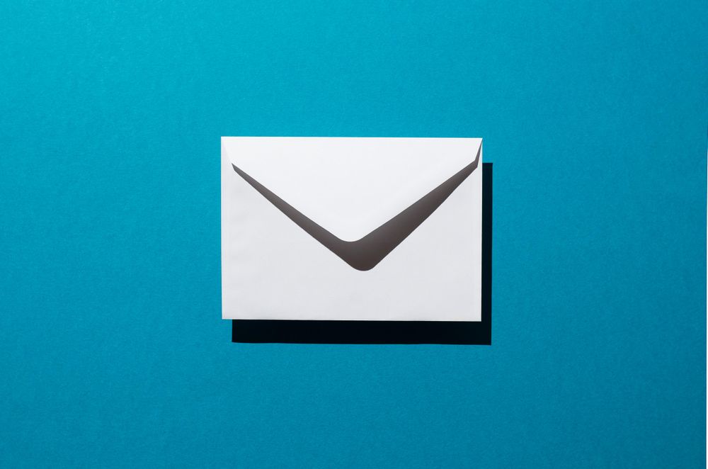 One light envelope over teal background