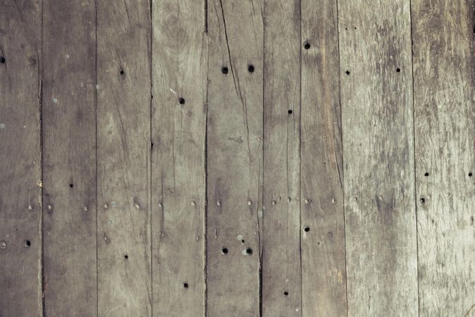 Rustic brown wooden board floor with nails