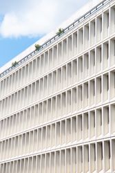 Ordered windows of facade of bright buliding