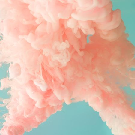 Cloud-like pastel pink color paint with teal background