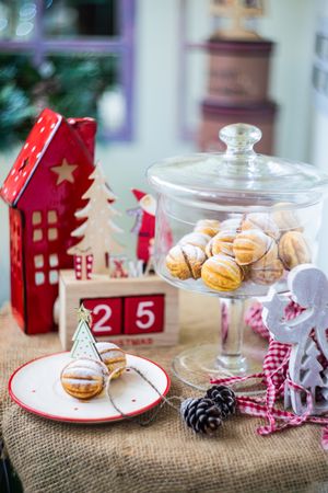 Holiday dessert cookies stuffed with caramel cream surrounded by Christmas ornaments