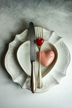 Top view of ornate plates for Valentine's day with heart shape decor