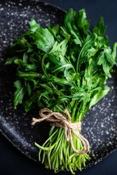 Close up of bunch of arugula